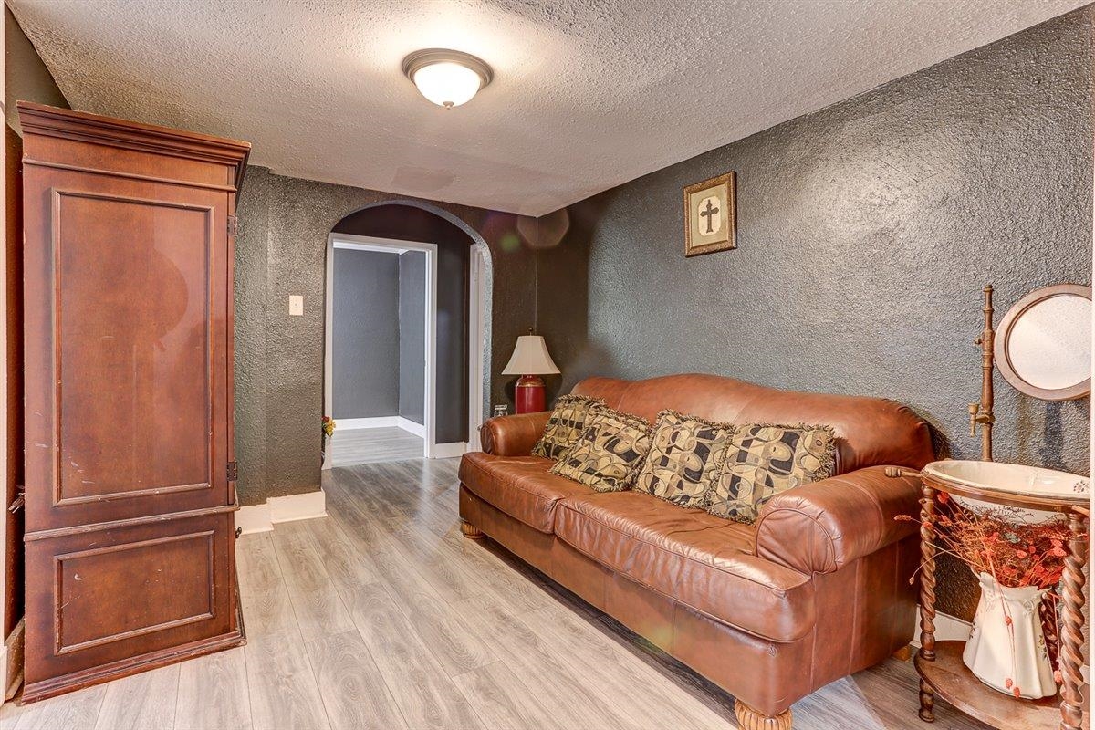 3700 Lakeview Road Memphis, TN 38116 - Photo 24 of 40 a bedroom with a bed window and wooden floor