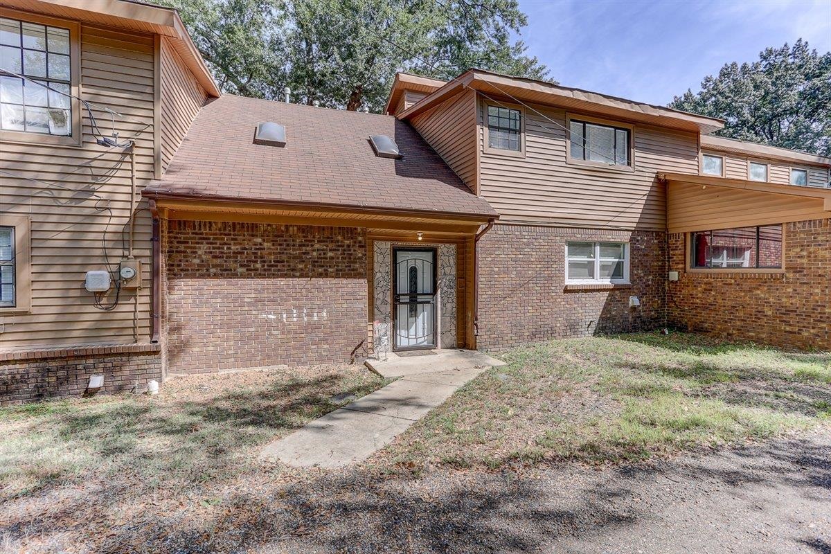 3700 Lakeview Road Memphis, TN 38116 - Photo 4 of 40 a front view of a house with a yard and garage