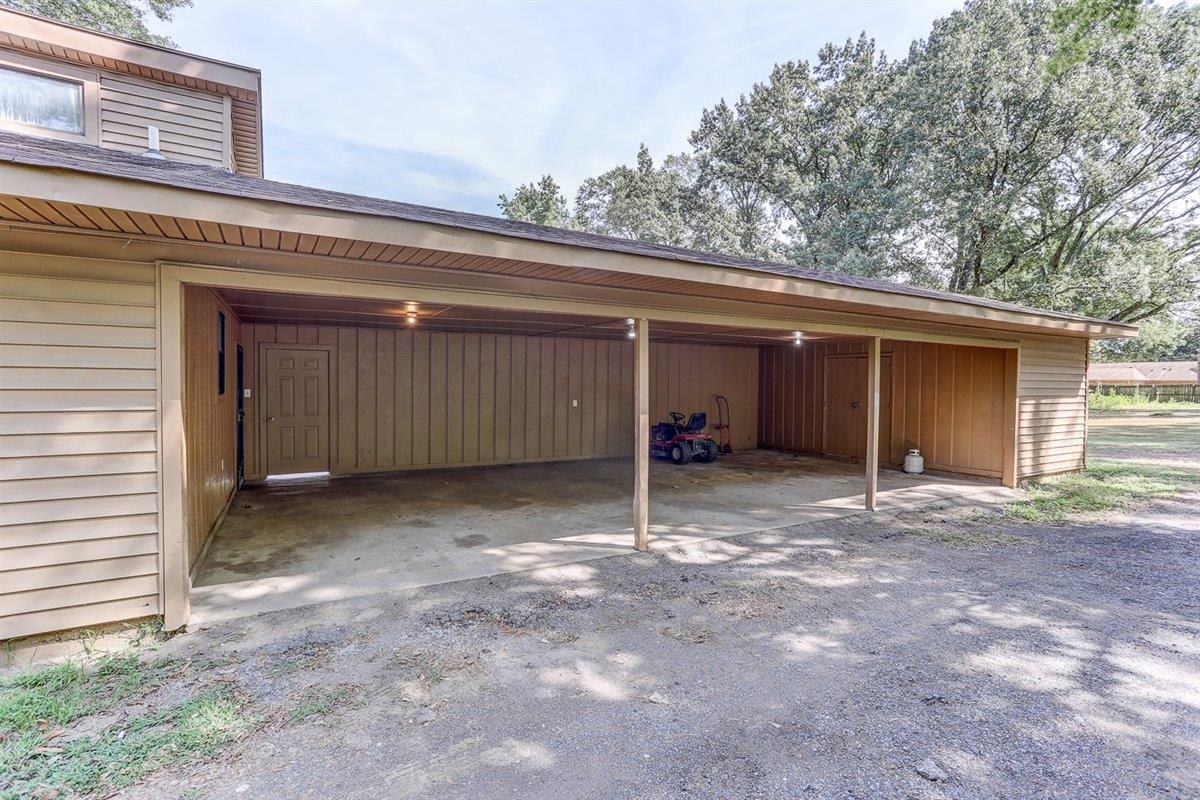3700 Lakeview Road Memphis, TN 38116 - Photo 5 of 40 a view of a house with a garage and yard