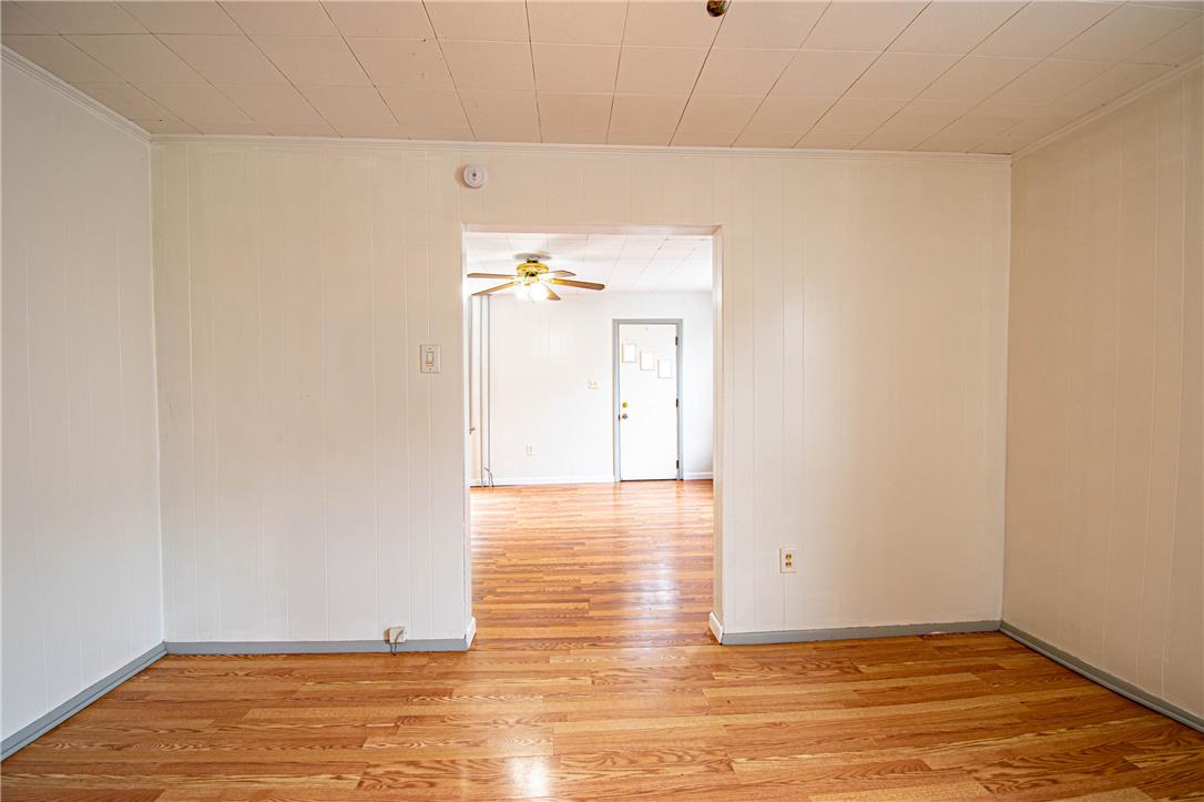 27 West Allen Street Allentown, PA 18102 - Photo 10 of 26 Natural wood flooring complements the bright wall paneling in this welcoming space.