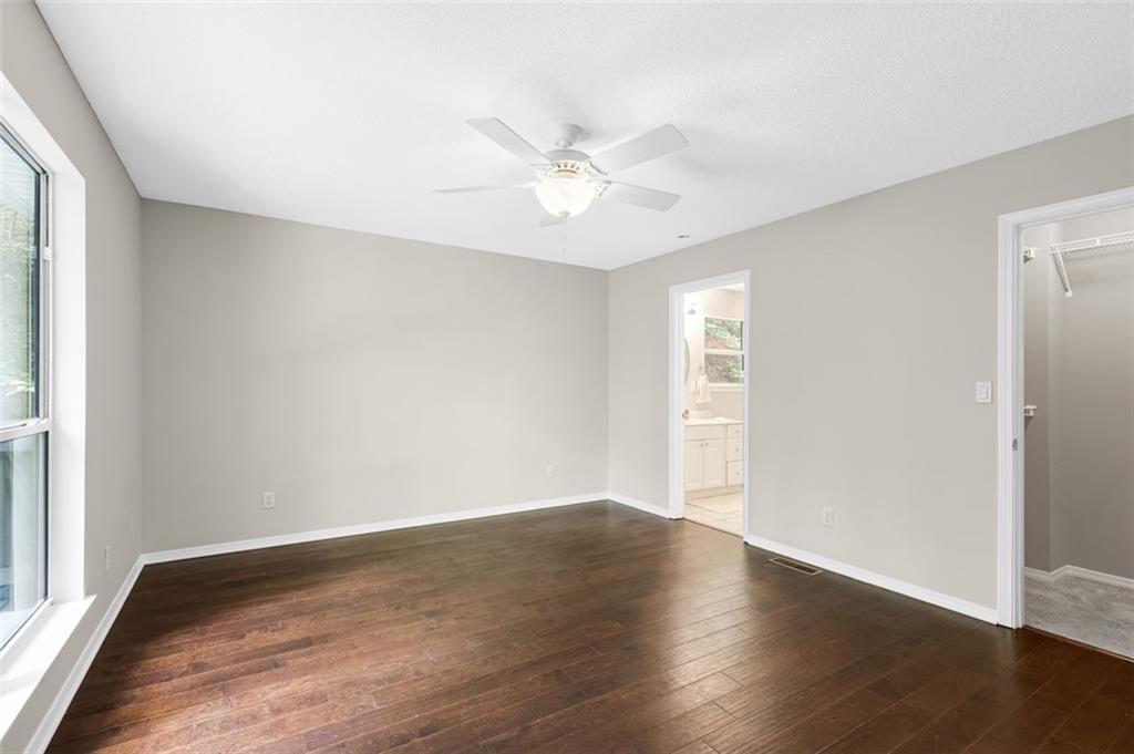 129 Jump Street Talking Rock, GA 30175 - Photo 17 of 45 a view of an empty room with wooden floor and a window