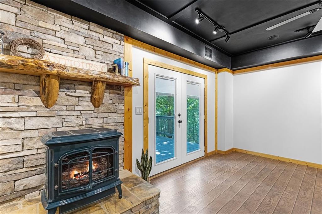 129 Jump Street Talking Rock, GA 30175 - Photo 21 of 45 a living room with wooden floors and a fireplace