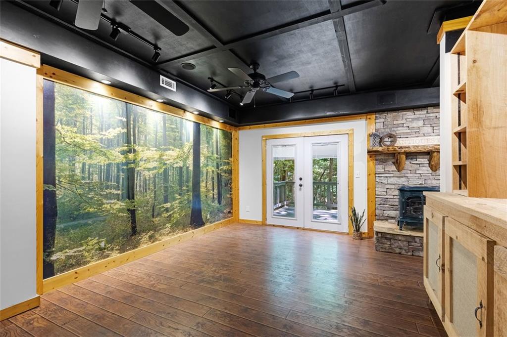 129 Jump Street Talking Rock, GA 30175 - Photo 22 of 45 a view of an empty room with wooden floor and a window