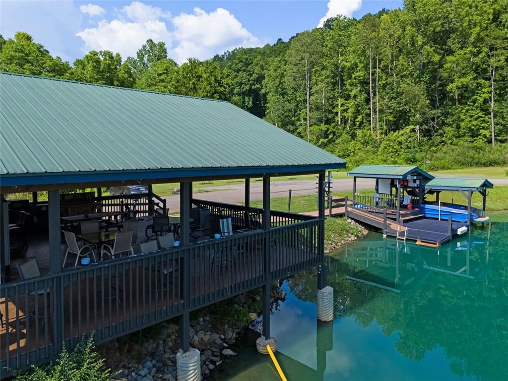 129 Jump Street Talking Rock, GA 30175 - Photo 36 of 45 a view of a patio with table and chairs under an umbrella
