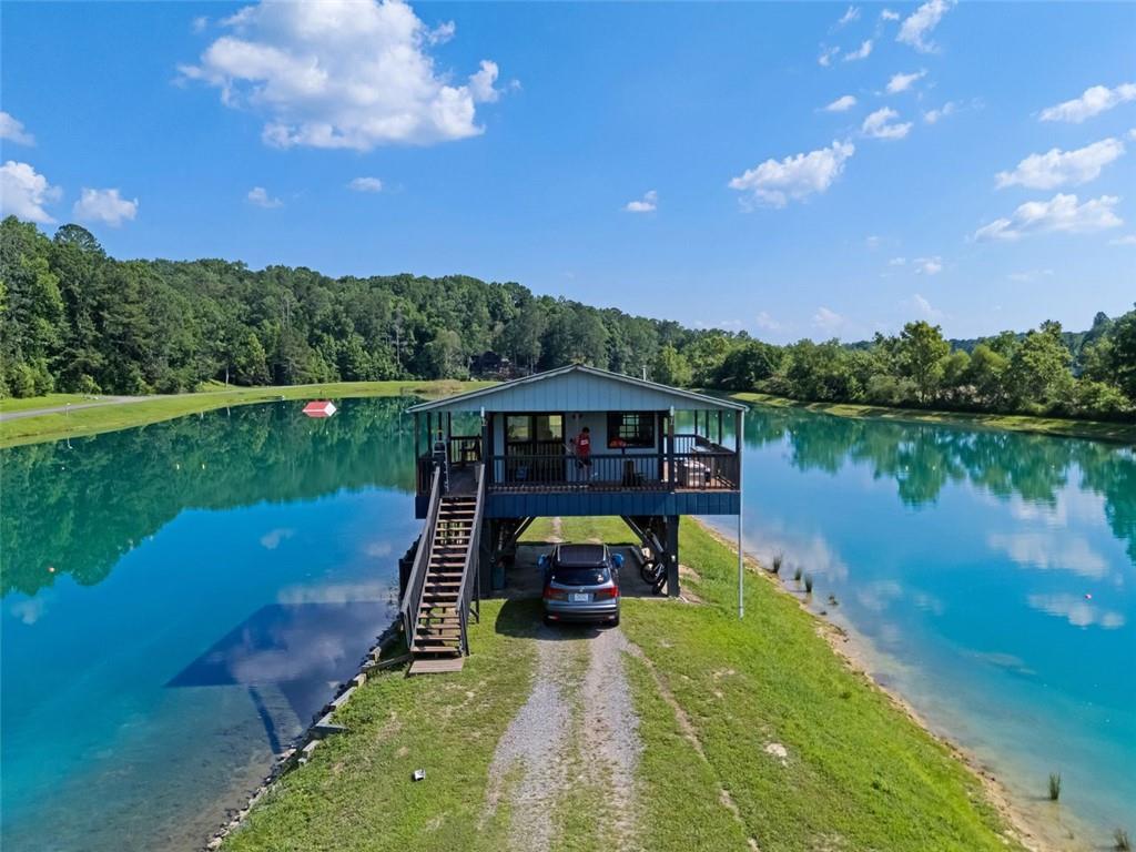 129 Jump Street Talking Rock, GA 30175 - Photo 44 of 45 a view of a lake with a yard