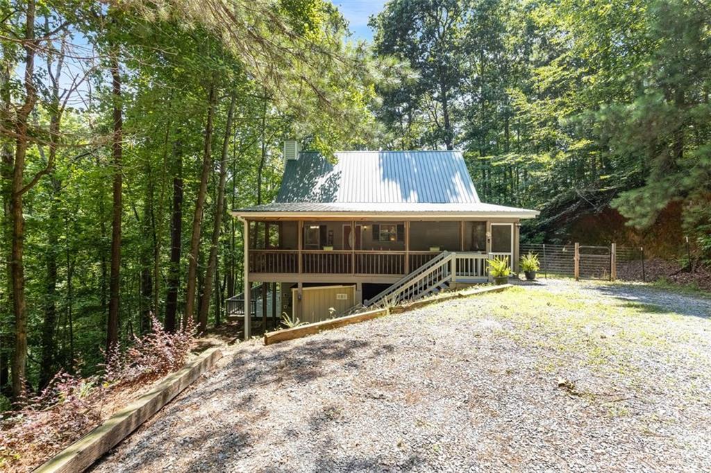 129 Jump Street Talking Rock, GA 30175 - Photo 5 of 45 a view of a house with a yard and sitting area