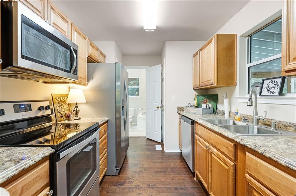 129 Jump Street Talking Rock, GA 30175 - Photo 9 of 45 a kitchen with stainless steel appliances granite countertop a sink stove and refrigerator