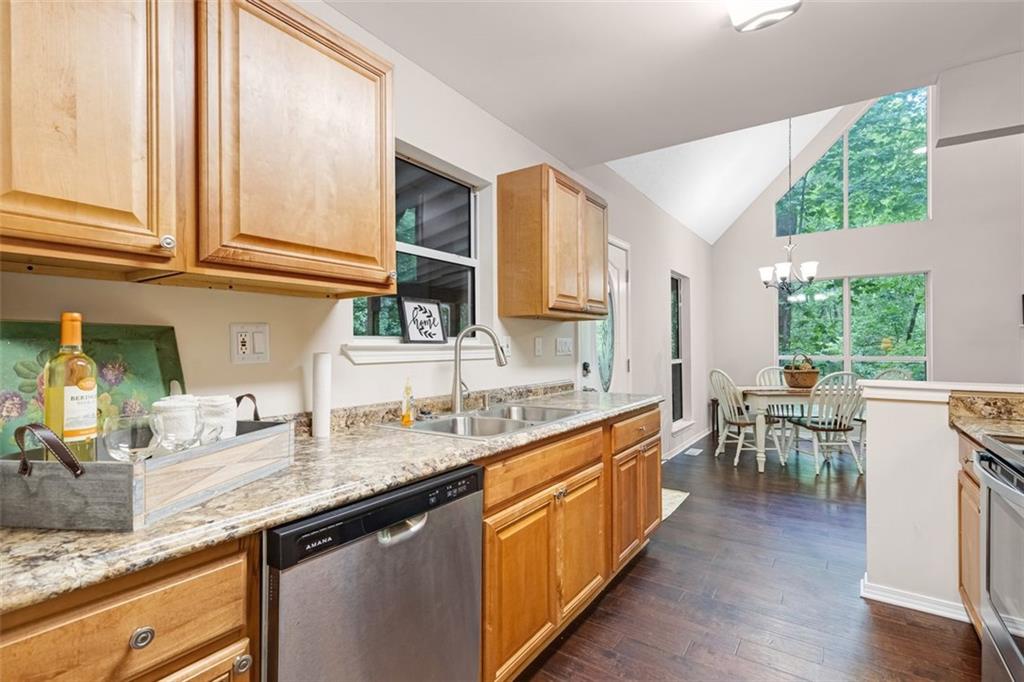 129 Jump Street Talking Rock, GA 30175 - Photo 10 of 45 a kitchen with stainless steel appliances granite countertop sink stove top oven and cabinets