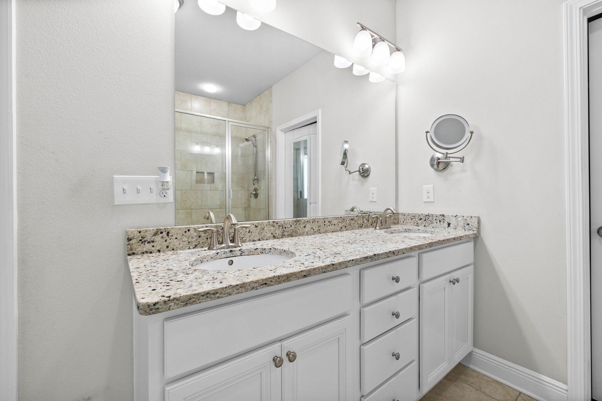 672 Alderberry Road Santa Rosa Beach, FL 32459 - Photo 12 of 24 a bathroom with a granite countertop sink and a mirror