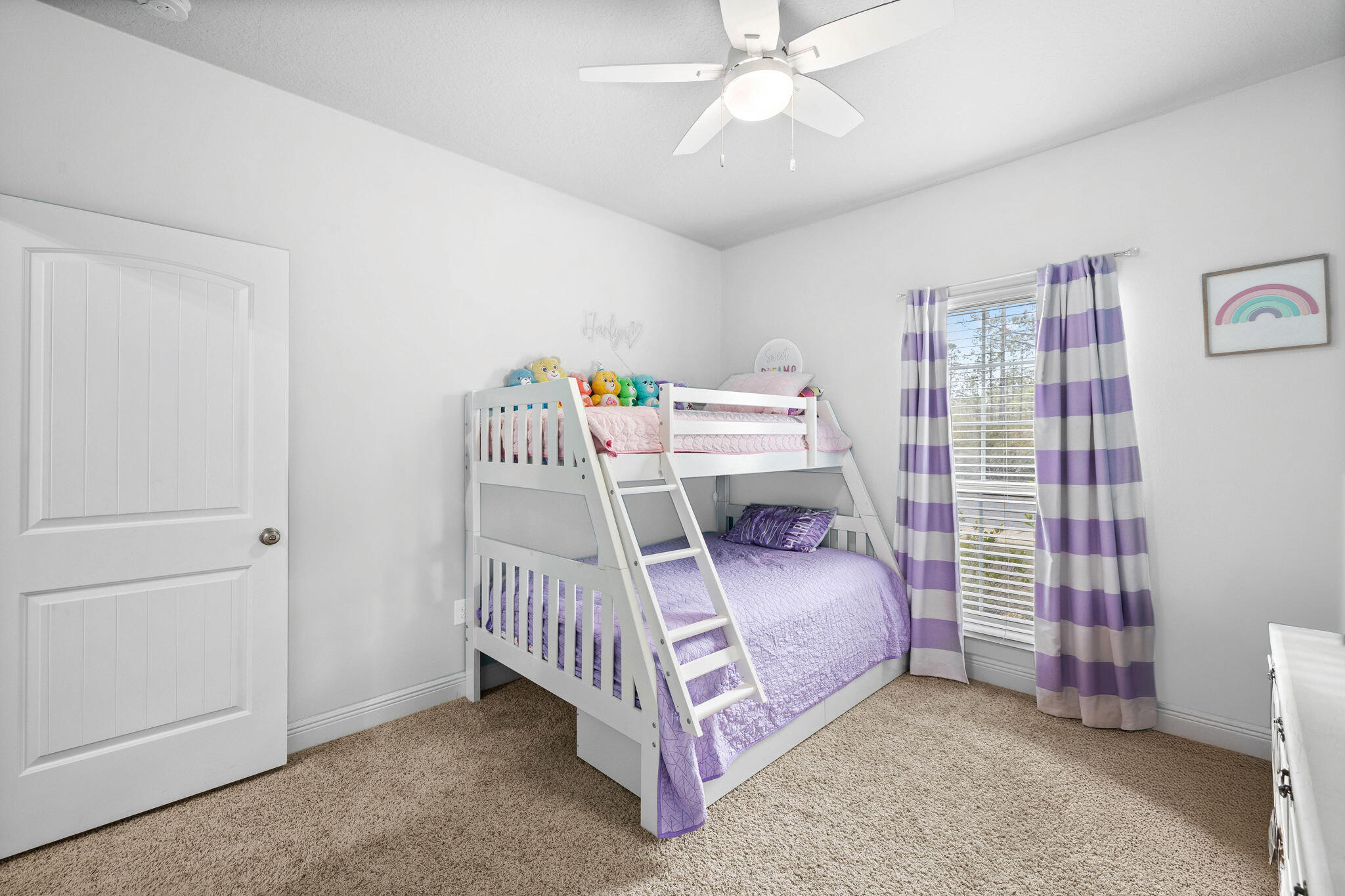 672 Alderberry Road Santa Rosa Beach, FL 32459 - Photo 14 of 24 a bedroom with a bed and a chandelier