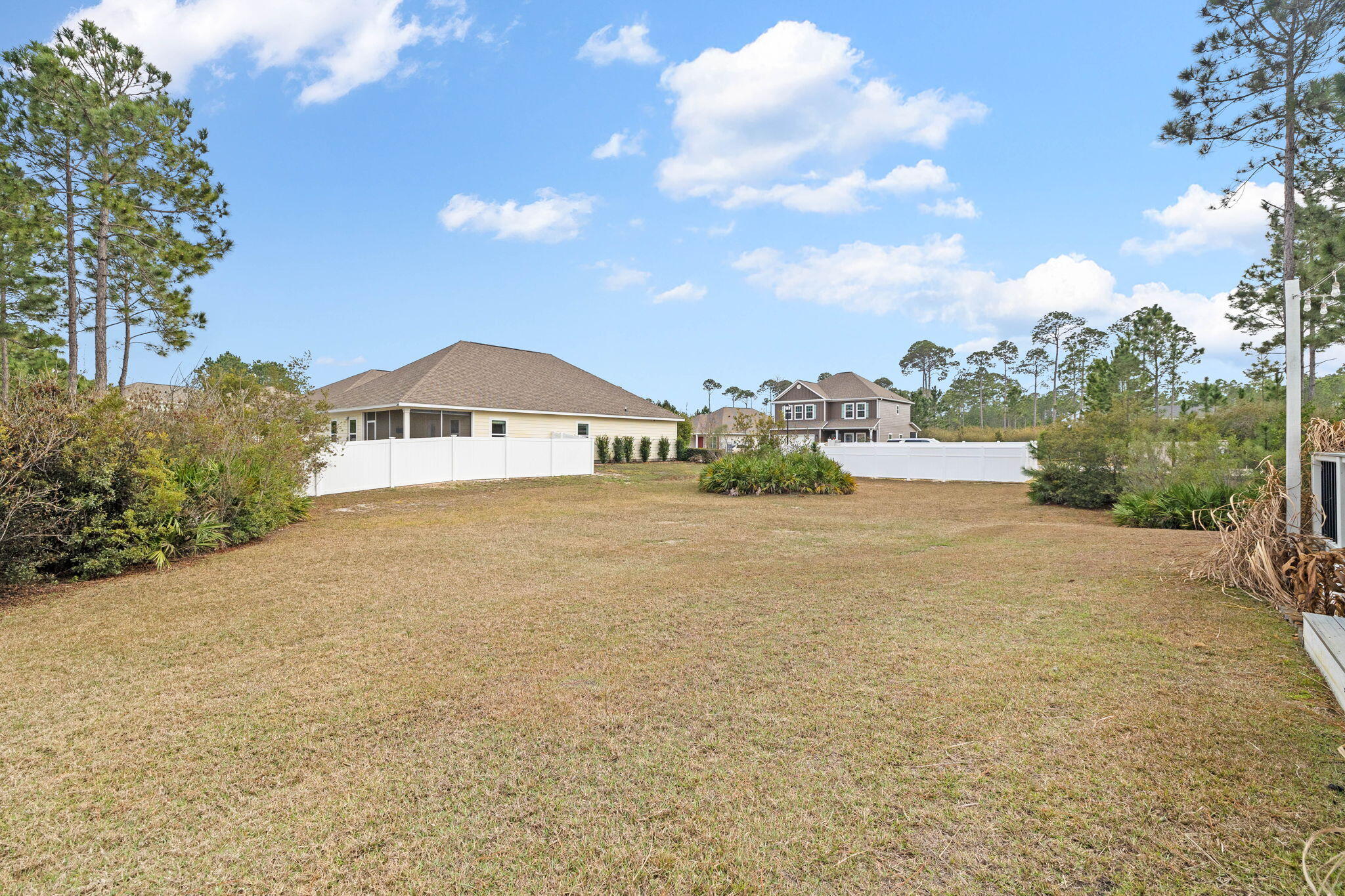 672 Alderberry Road Santa Rosa Beach, FL 32459 - Photo 20 of 24 a view of a house with a yard and balcony
