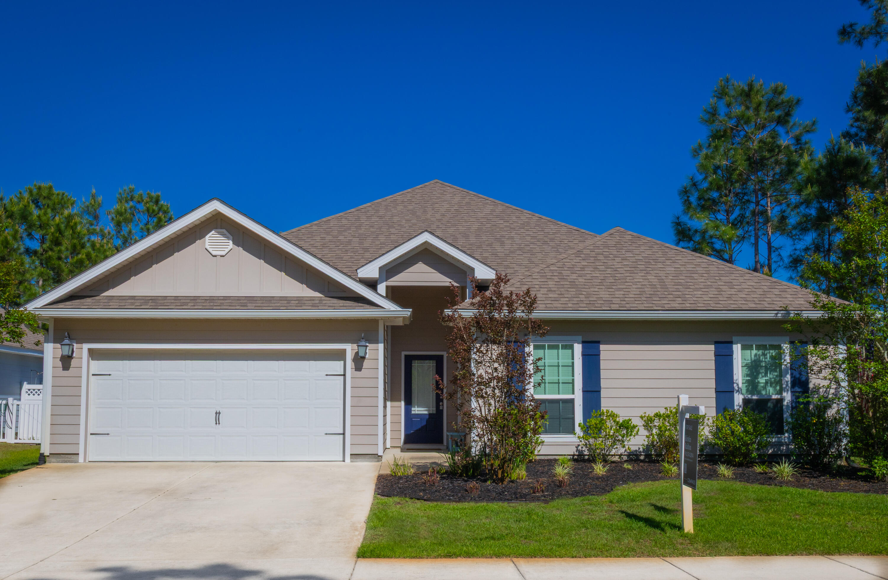672 Alderberry Road Santa Rosa Beach, FL 32459 - Photo 23 of 24 a front view of a house with garden