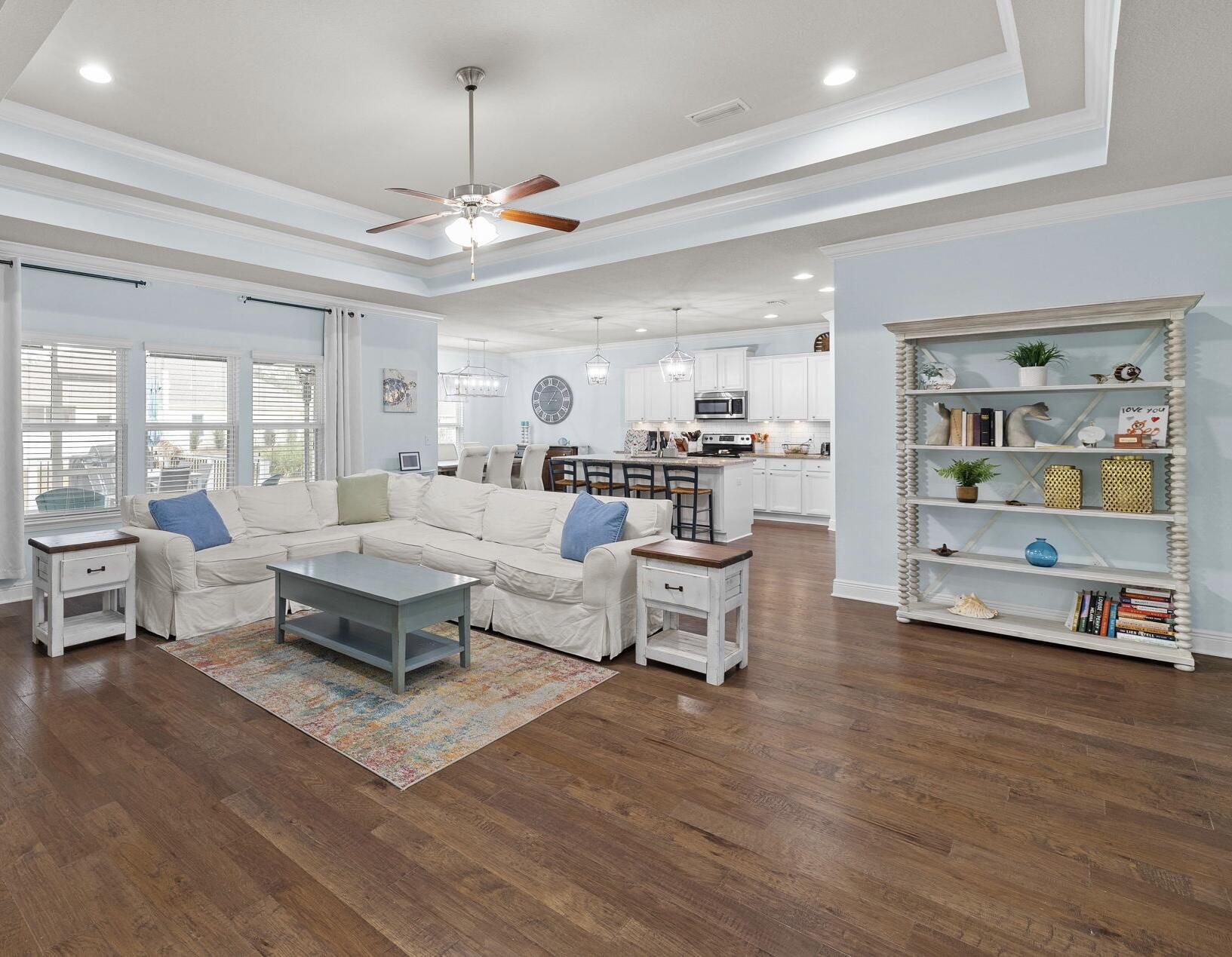 672 Alderberry Road Santa Rosa Beach, FL 32459 - Photo 7 of 24 a living room with furniture and a chandelier
