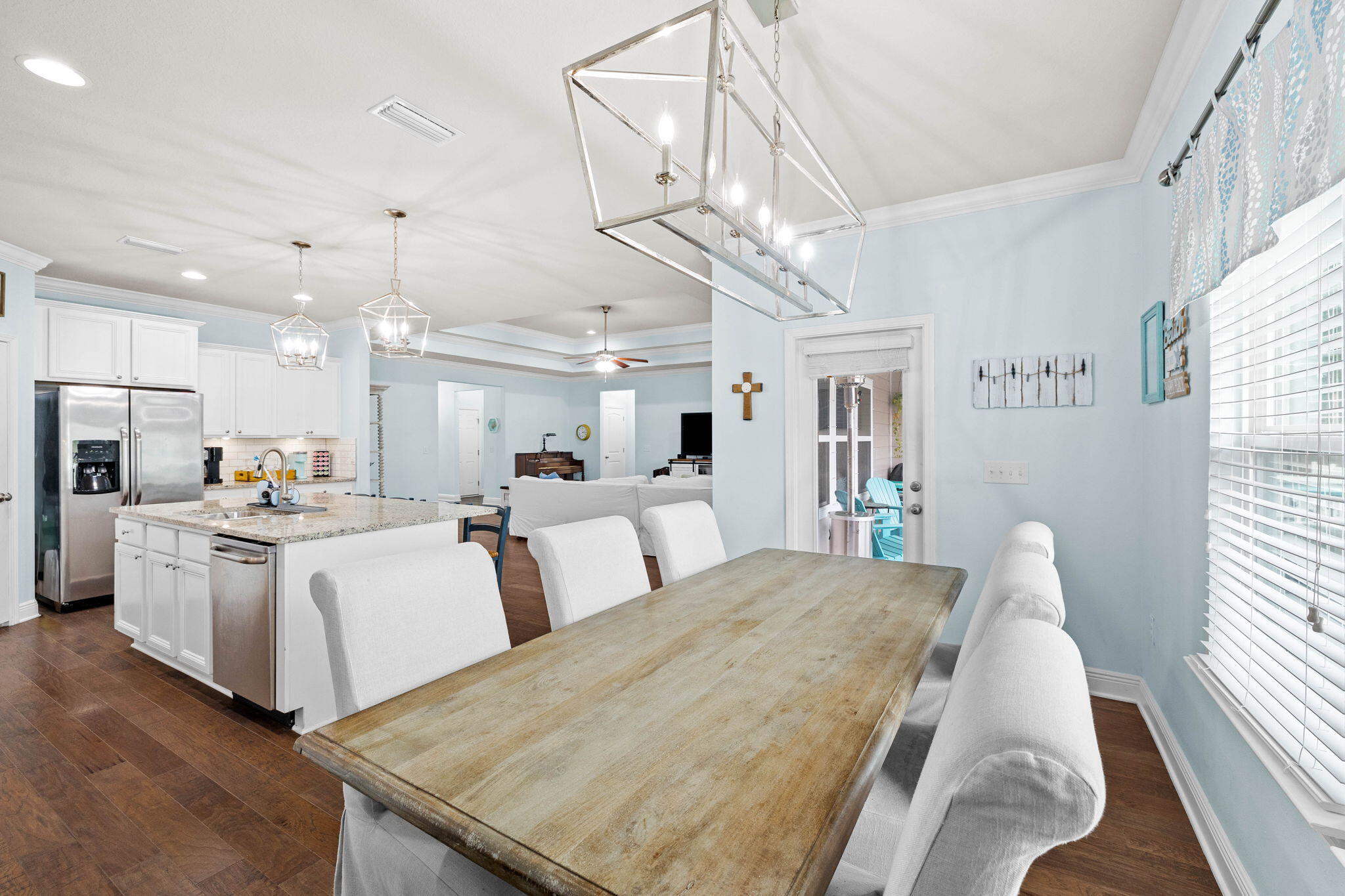 672 Alderberry Road Santa Rosa Beach, FL 32459 - Photo 10 of 24 a large white kitchen with lots of counter space wooden floor and appliances