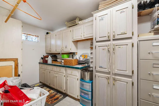 a kitchen with stainless steel appliances granite countertop a refrigerator sink and cabinets