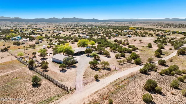 an aerial view of house with yard