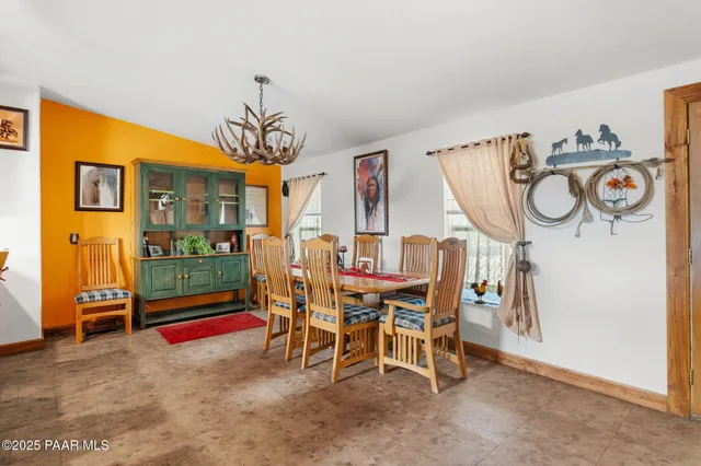 a dining room with furniture and window