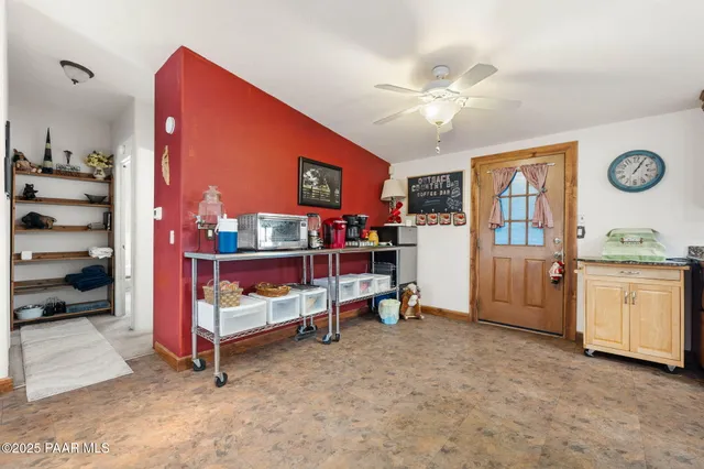 a view of an empty room and workspace