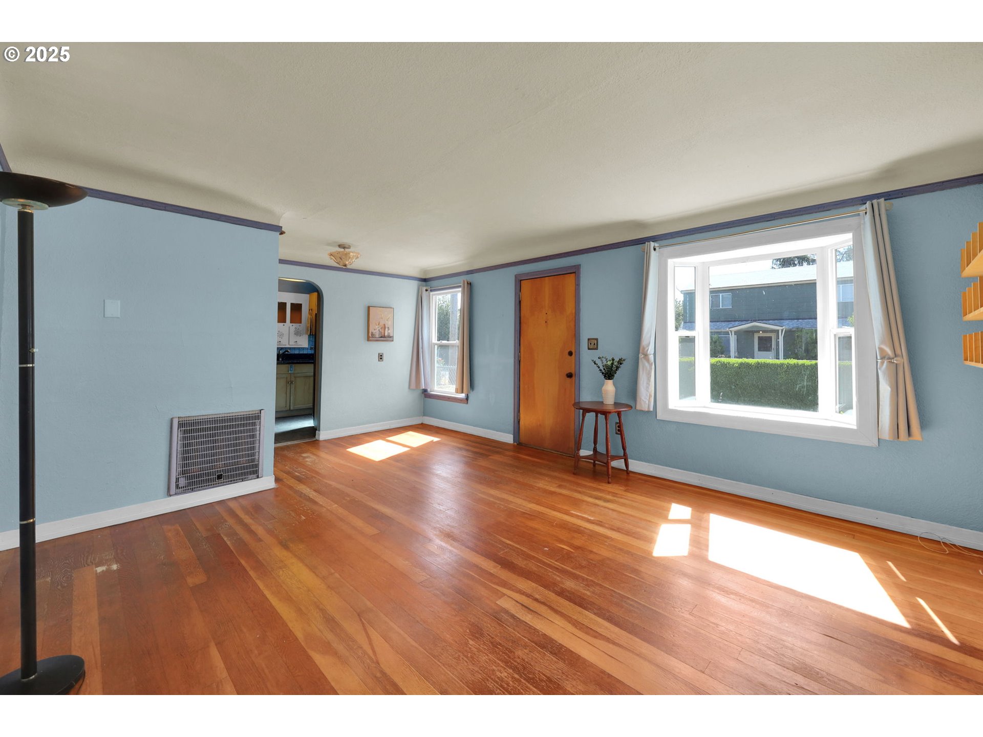 183 South 50th Place Springfield, OR 97478 - Photo 4 of 29 a view of an empty room with window and wooden floor