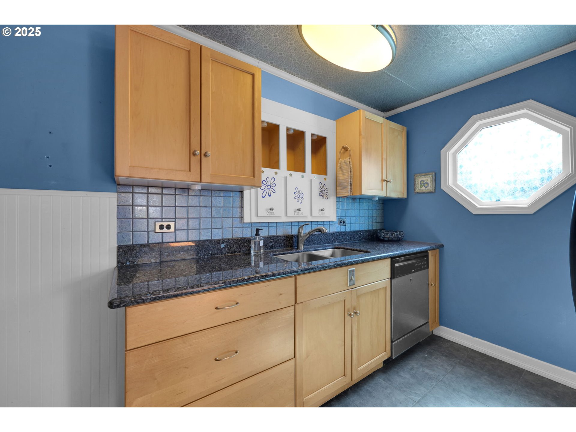 183 South 50th Place Springfield, OR 97478 - Photo 8 of 29 a kitchen with granite countertop a sink a stove and cabinets