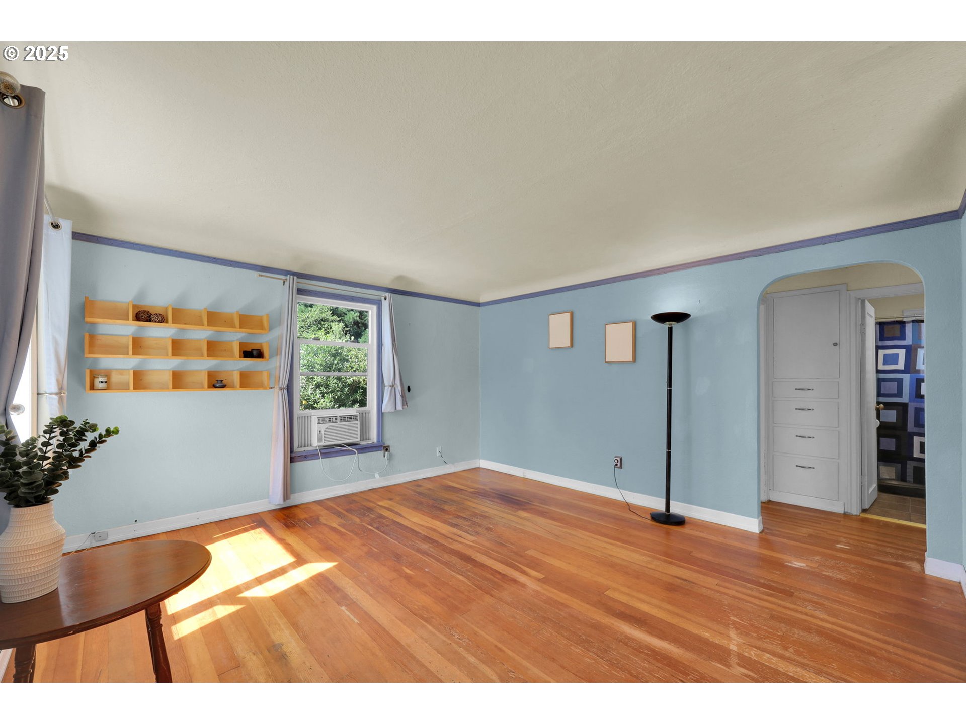 183 South 50th Place Springfield, OR 97478 - Photo 10 of 29 a view of an empty room with wooden floor and a window