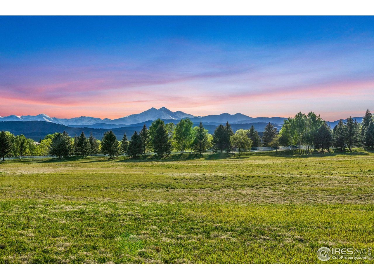 9715 Meadow Ridge Lane Longmont, CO 80504 - Photo 1 of 23 Unobstructed evening view of mountain range from lot.
