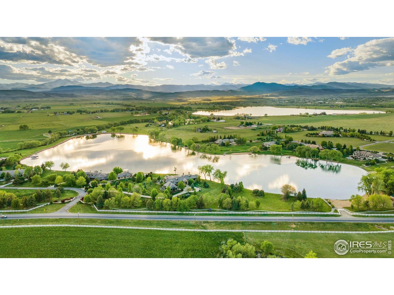 9715 Meadow Ridge Lane Longmont, CO 80504 - Photo 21 of 23 Looking west from lot at Crystal Lake. Beach access on right.