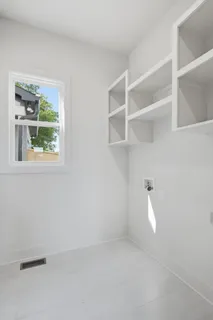 a view of an empty room with a window