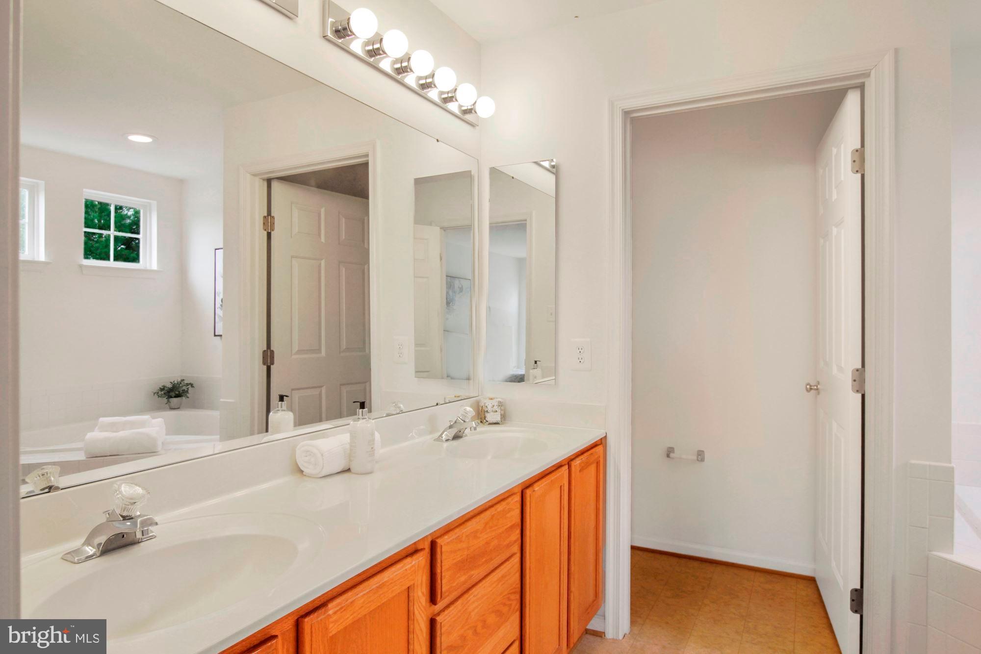 15305 Riding Path Court Laurel, MD 20707 - Photo 13 of 21 Primary bathroom with dual sink vanity