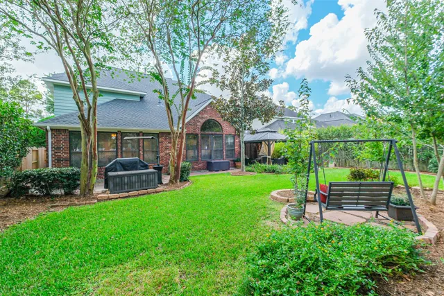 a house view with a sitting space and garden