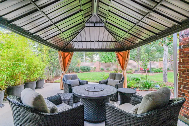 a view of a patio in the backyard