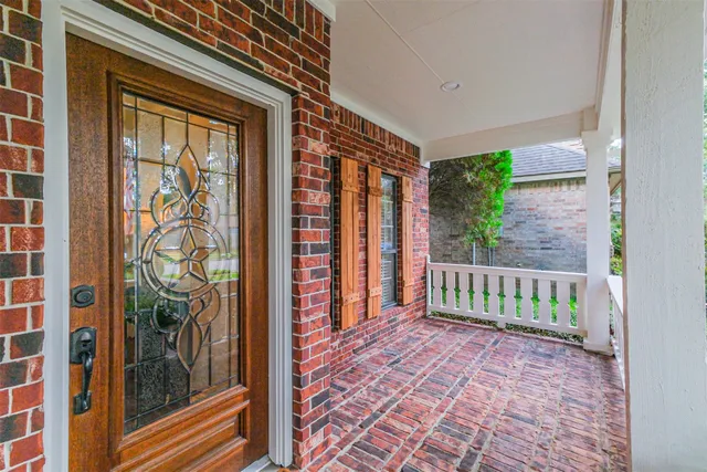 a view of a porch with a floor to ceiling window
