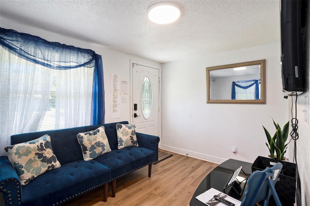 4609 Horton Road Plant City, FL 33567 - Photo 33 of 47 a living room with furniture and a flat screen tv