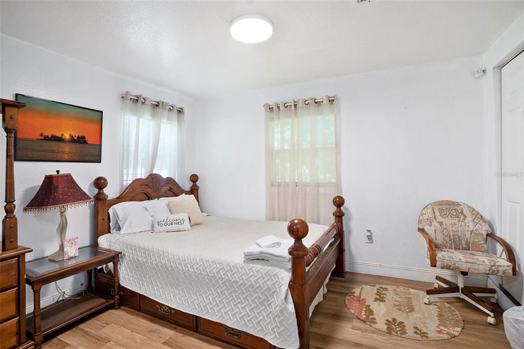 4609 Horton Road Plant City, FL 33567 - Photo 47 of 47 a bedroom with a bed and wooden floor