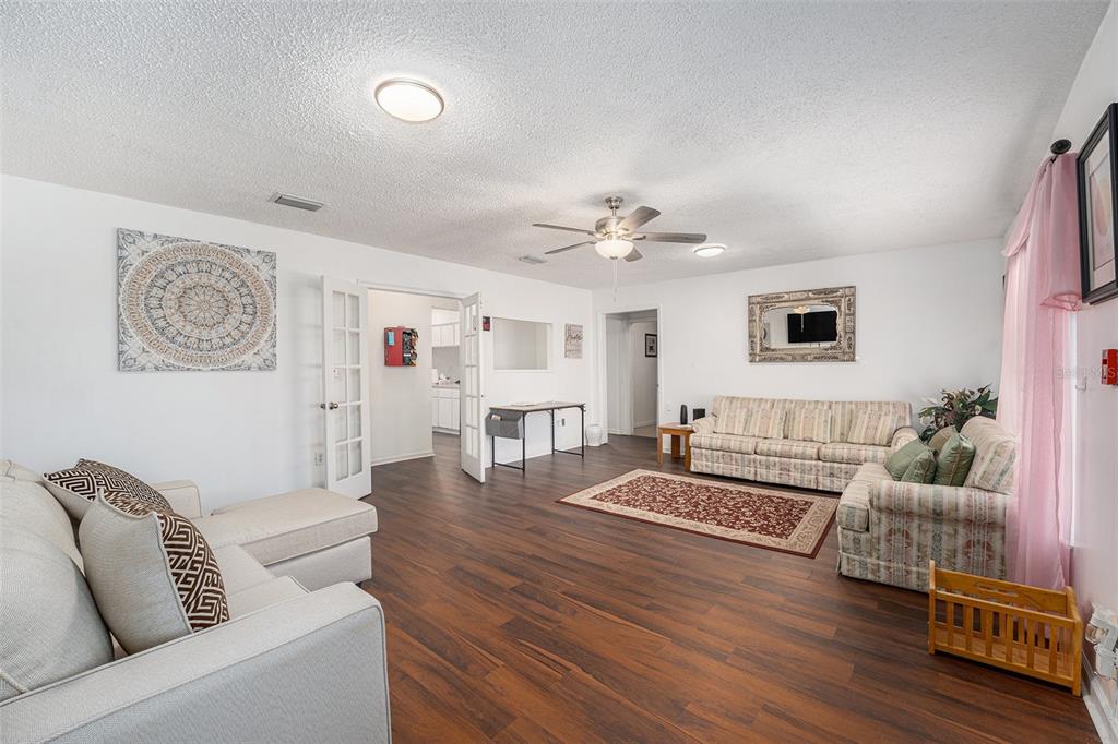4609 Horton Road Plant City, FL 33567 - Photo 7 of 47 a living room with furniture and wooden floor