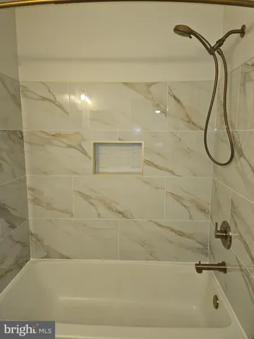 an empty room with a fireplace