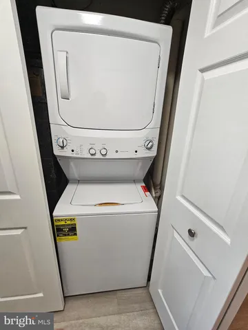 a kitchen with a refrigerator and a stove