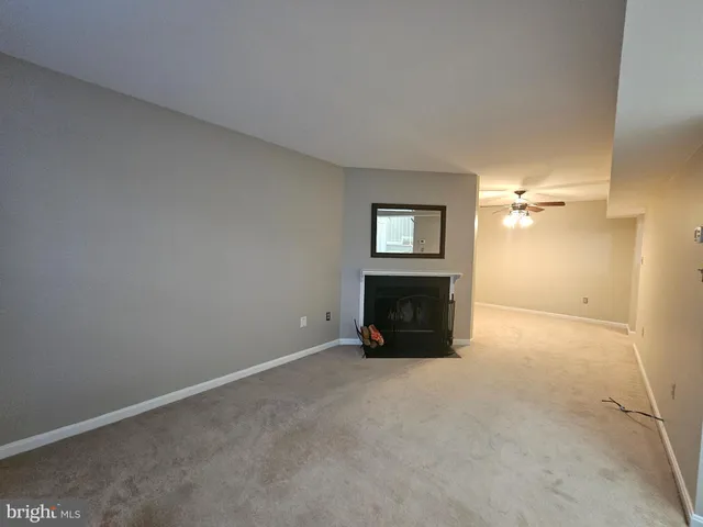 a view of a hallway with stairs