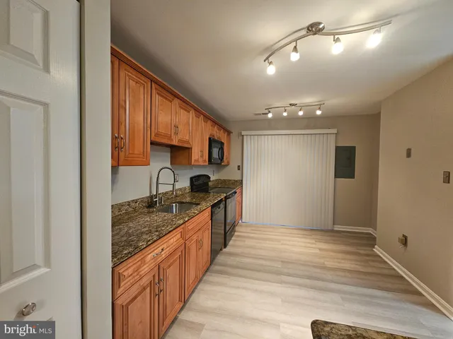 a view of an empty room with a glass door