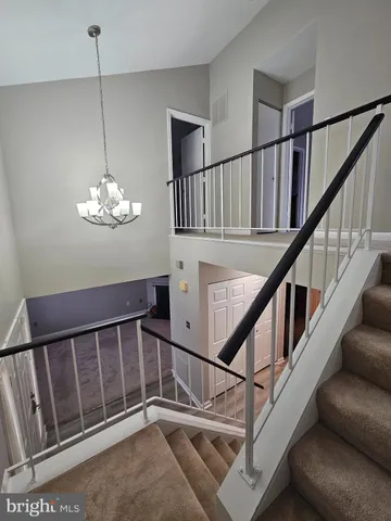 a kitchen with stainless steel appliances granite countertop a stove a sink dishwasher and a microwave oven with cabinets