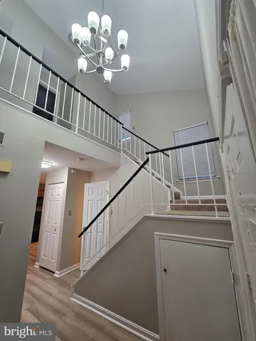 a kitchen with granite countertop a stove top oven sink and cabinets