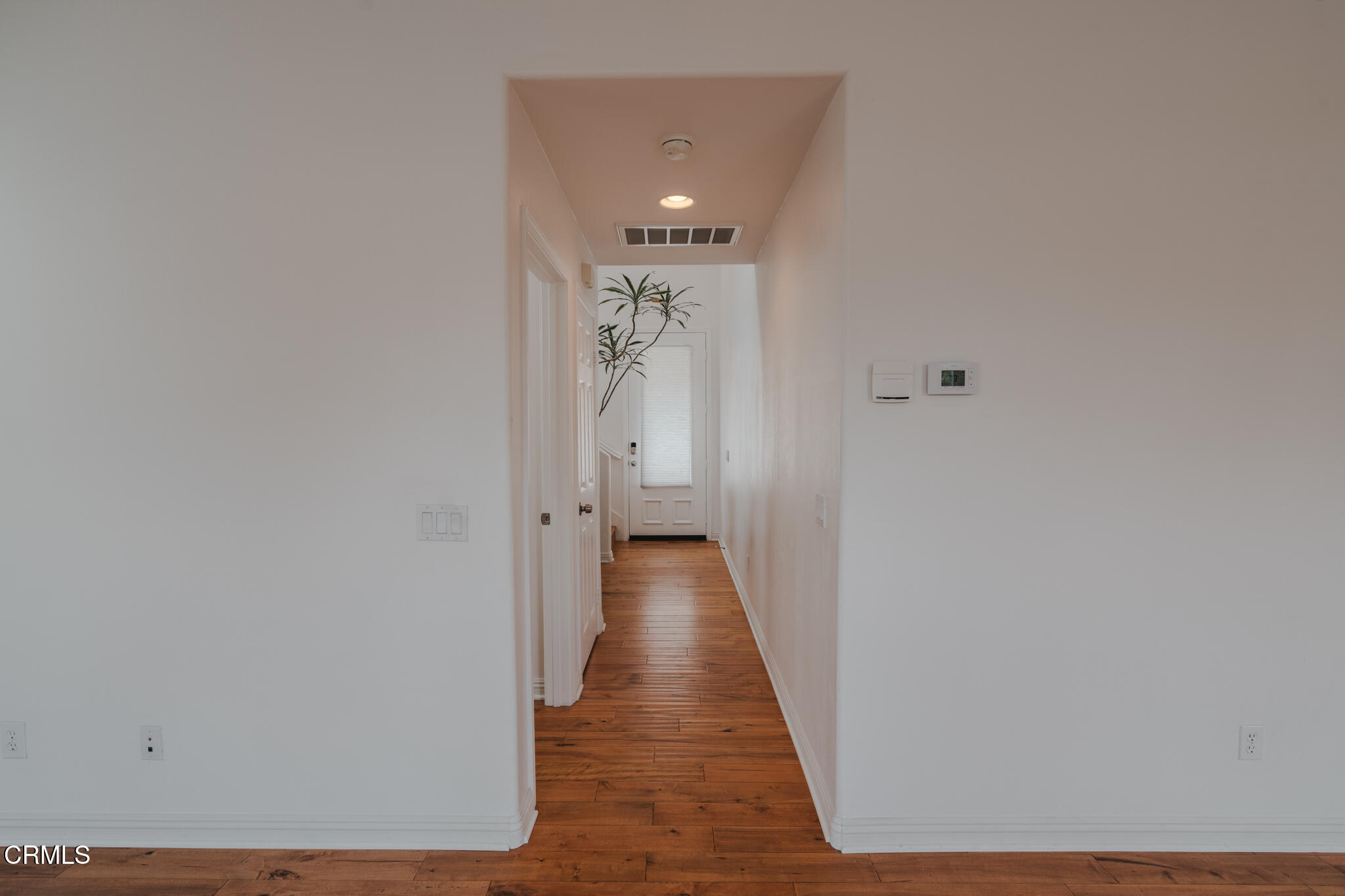 525 Shell Harbor Lane Port Hueneme, CA 93041 - Photo 12 of 47 a view of a hallway with wooden floor