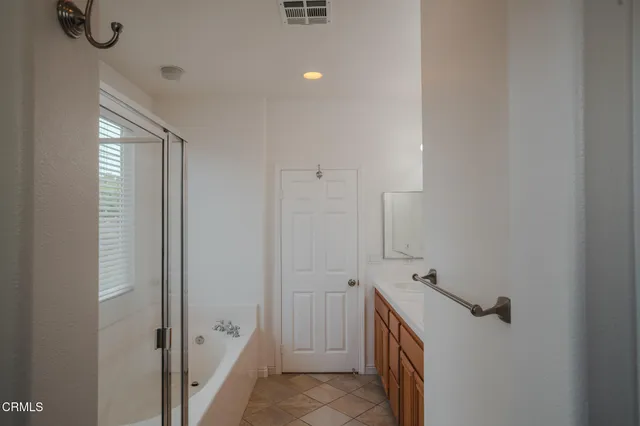 a bathroom with a sink and shower