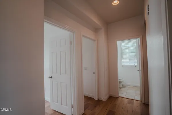 a view of a bathroom with wooden floor