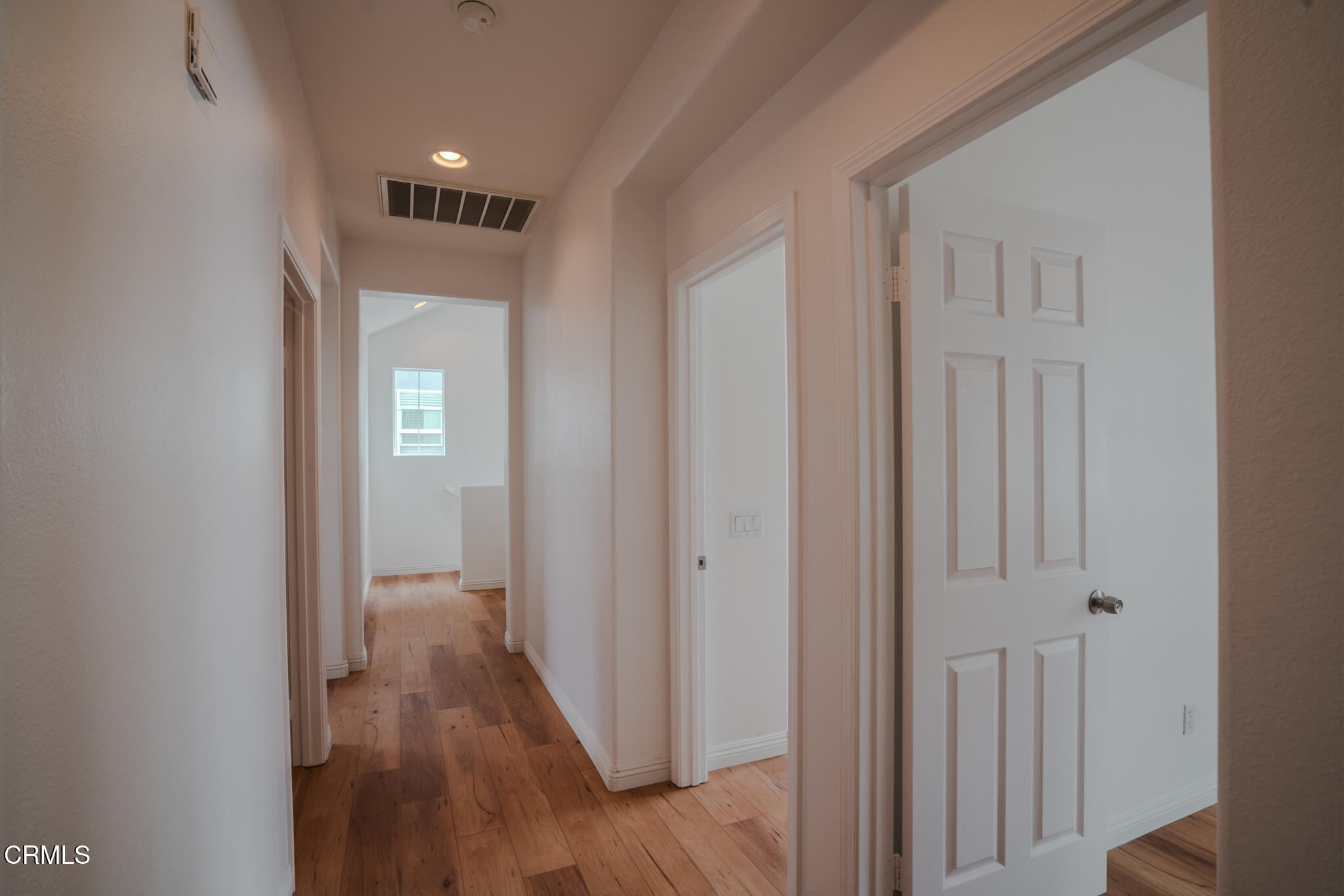 525 Shell Harbor Lane Port Hueneme, CA 93041 - Photo 33 of 47 a view of a hallway with wooden floor