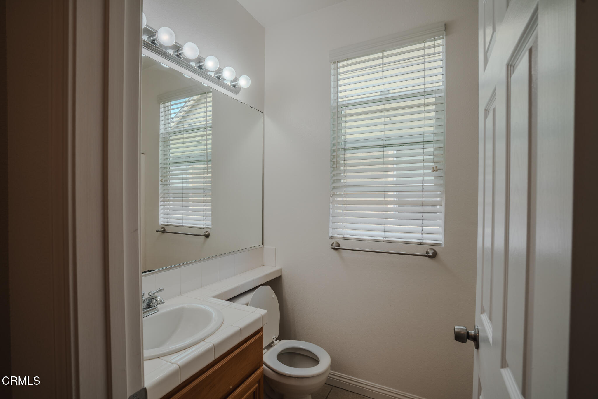 525 Shell Harbor Lane Port Hueneme, CA 93041 - Photo 34 of 47 a bathroom with a granite countertop toilet a sink and a bathtub