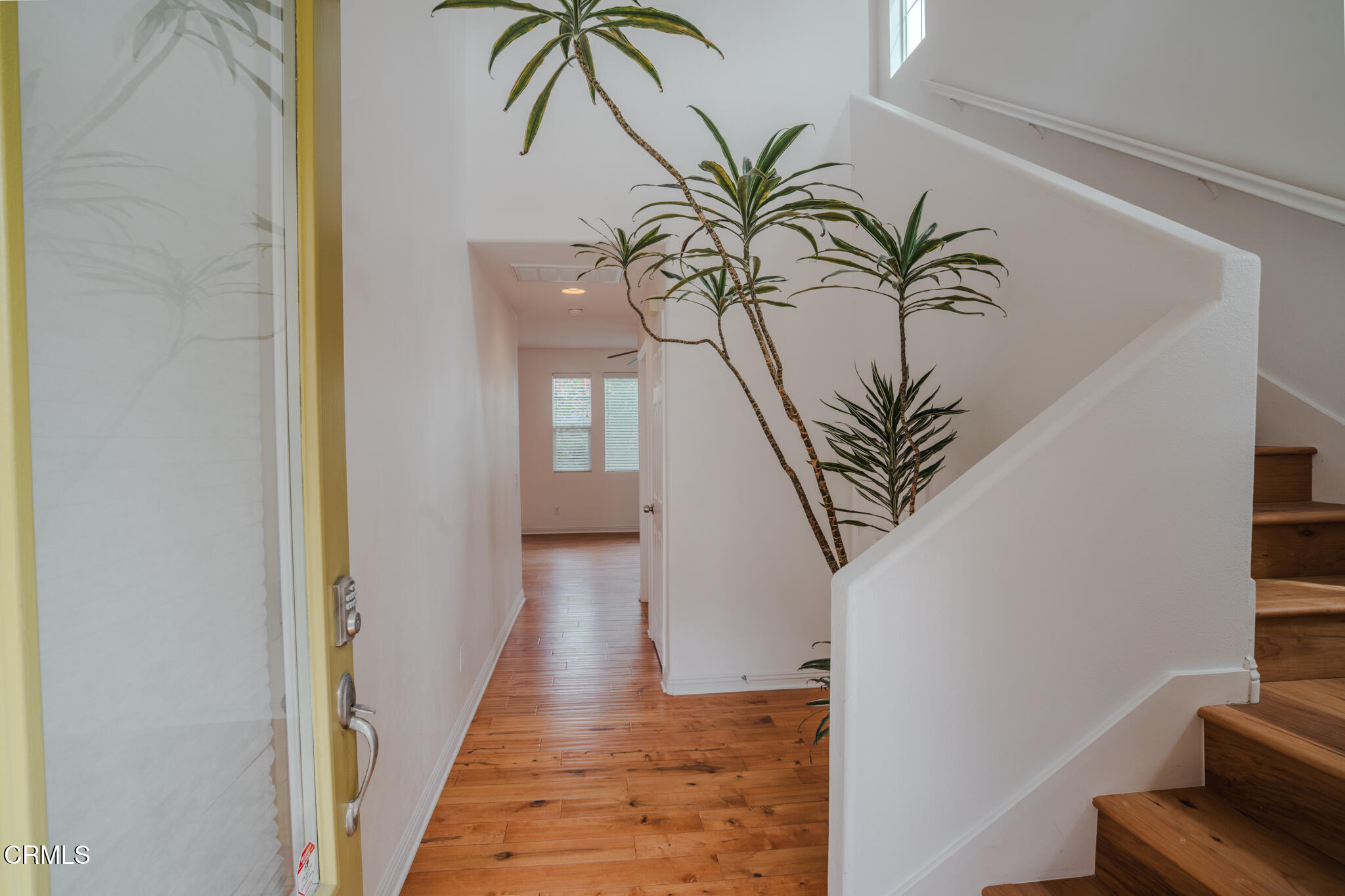525 Shell Harbor Lane Port Hueneme, CA 93041 - Photo 6 of 47 a view of a hallway with paintings on the wall