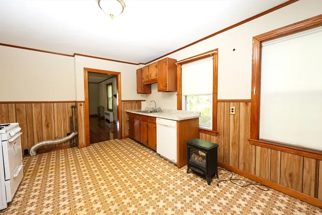 a room with a bed furniture and a window