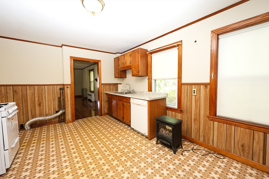 354 Pond Street, Unit 354 Braintree, MA 02184 - Photo 19 of 30 a room with a bed furniture and a window