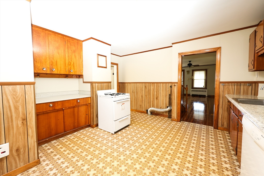 354 Pond Street, Unit 354 Braintree, MA 02184 - Photo 20 of 30 a room with a bed and furniture